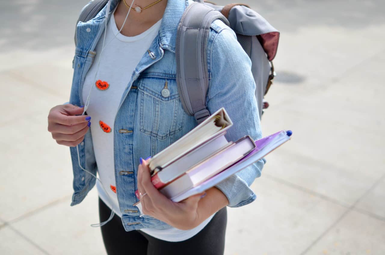 Girl with books going to college